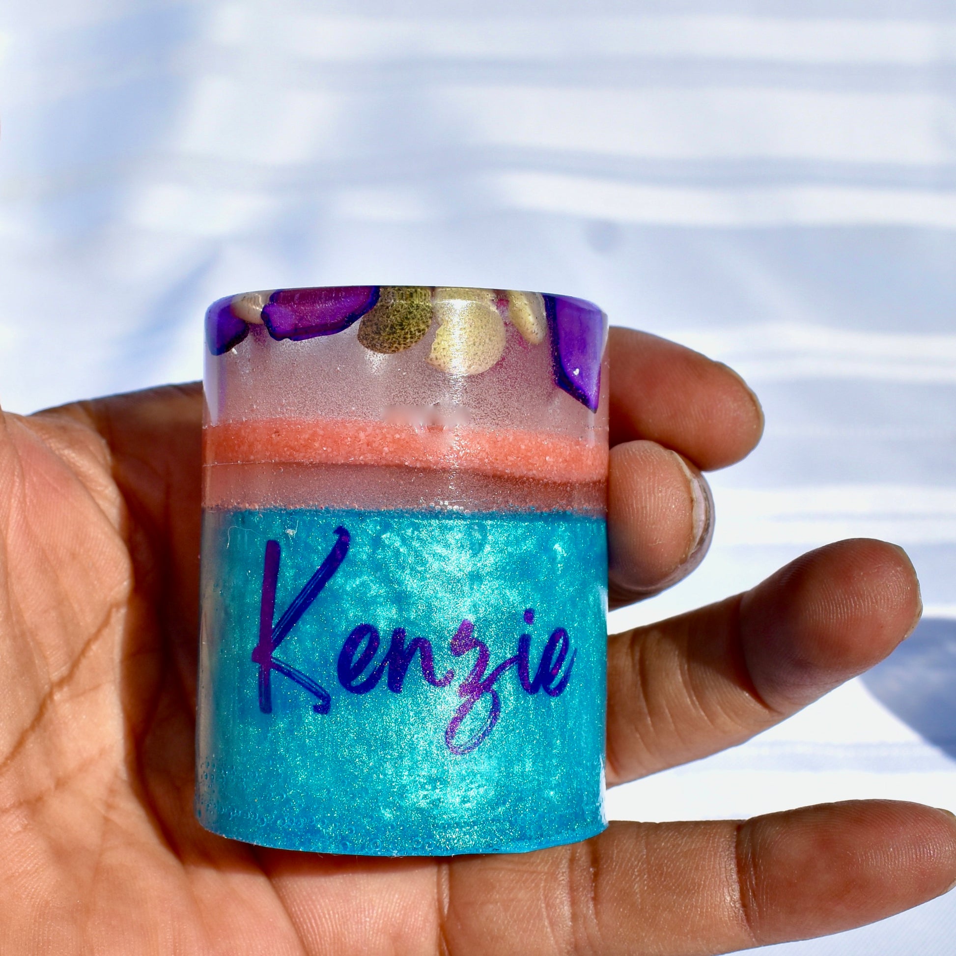 Seashell resin shot glass personalized with a name.