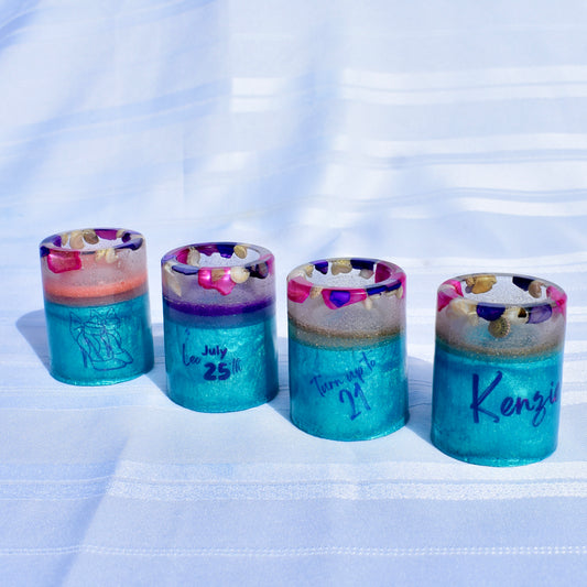 Set of beach-themed resin shot glasses personalized with name, birthdate, Leo zodiac sign, high heels, and a microphone.