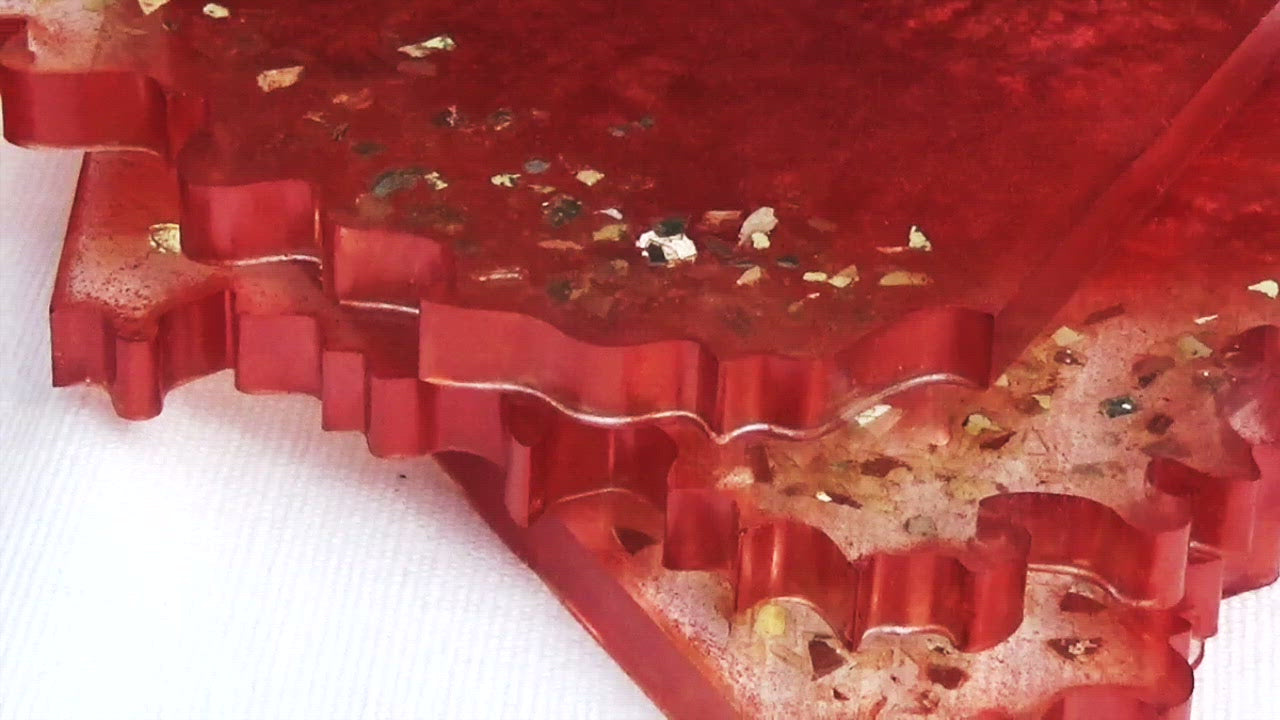 Cranberry colored resin coasters with wavy edge and cut glass